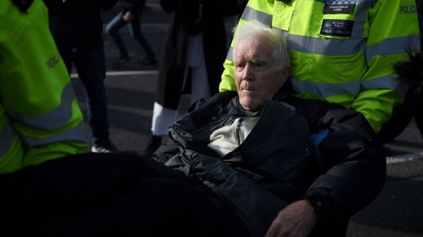 
                              Extinction Rebellion protester climbs on plane at London City Airport
                      